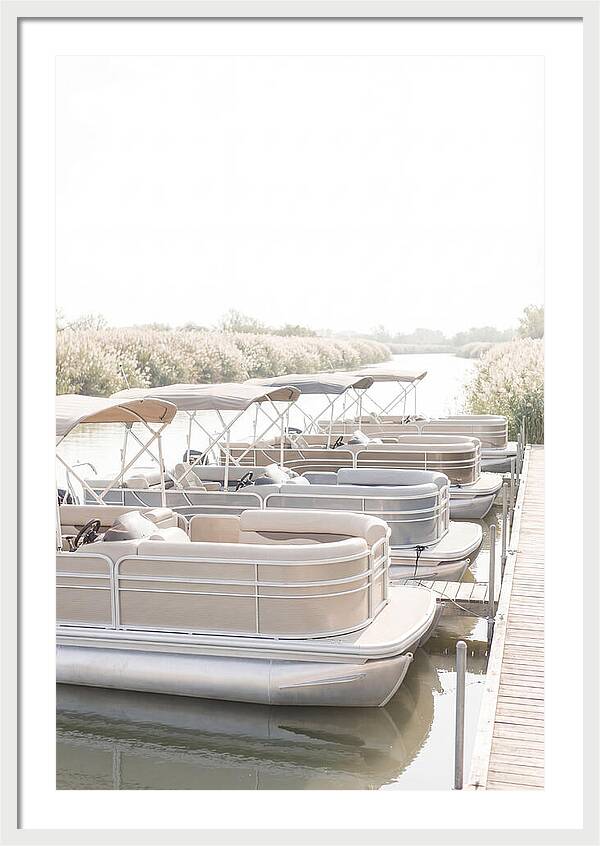 Pontoon Boats Along Reed Lined River