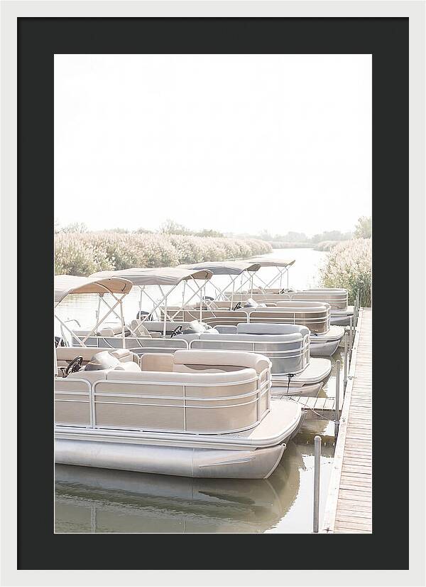 Pontoon Boats Along Reed Lined River