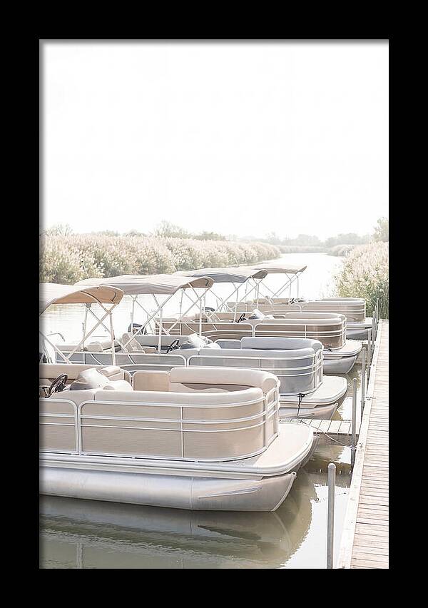 Pontoon Boats Along Reed Lined River