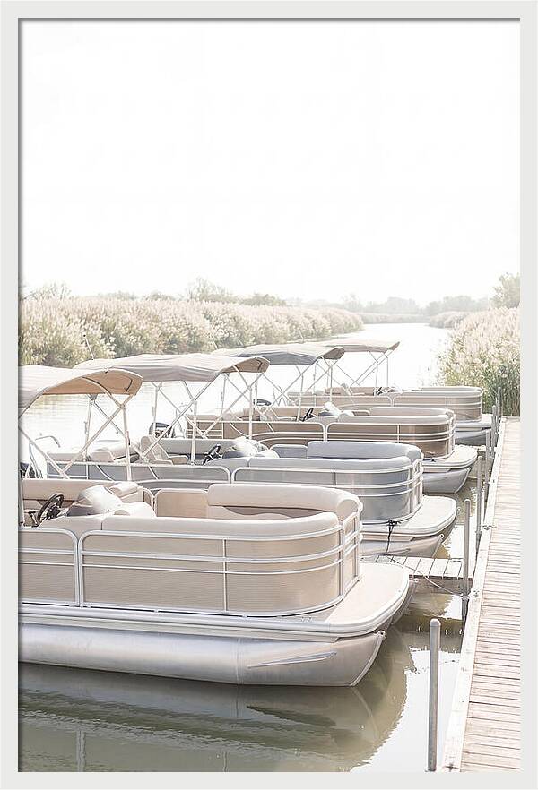 Pontoon Boats Along Reed Lined River