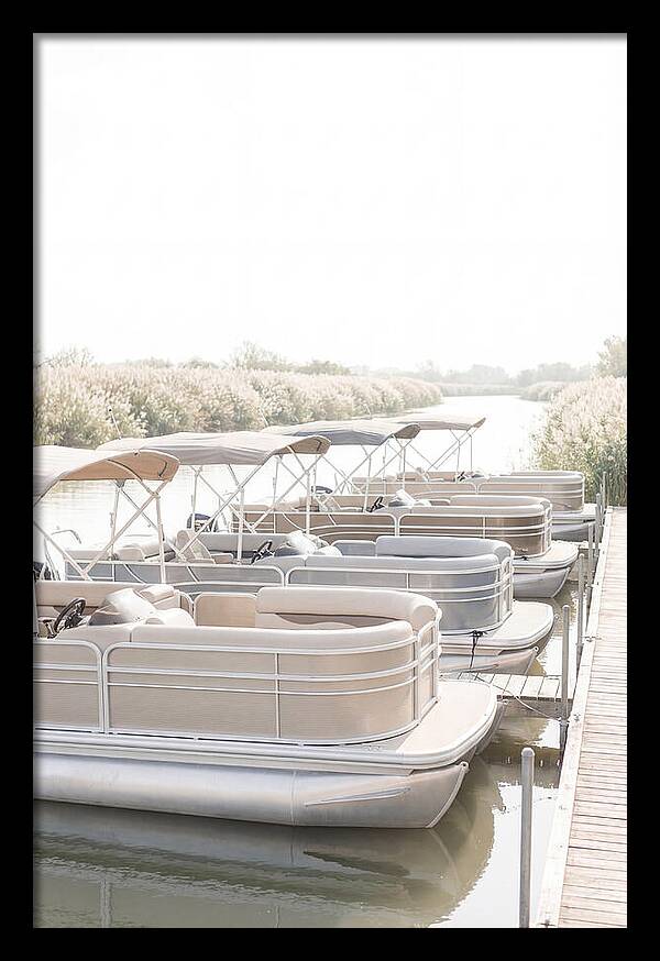 Pontoon Boats Along Reed Lined River