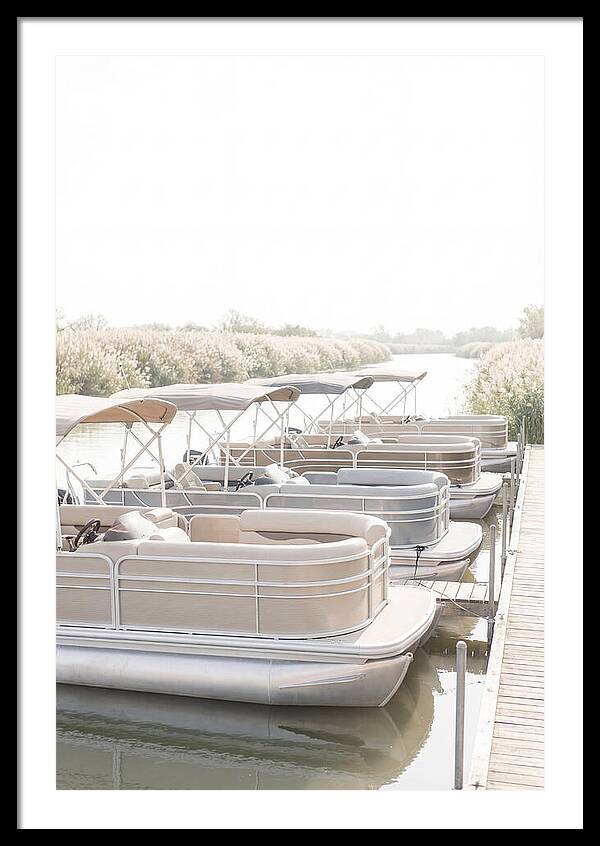Pontoon Boats Along Reed Lined River
