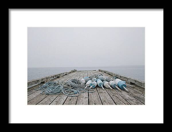 Rope And Lobster Buoys On Dock
