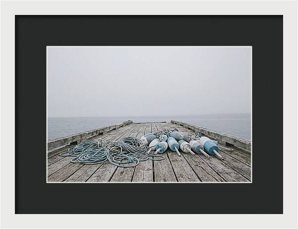 Rope And Lobster Buoys On Dock