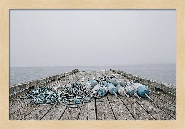 Rope And Lobster Buoys On Dock