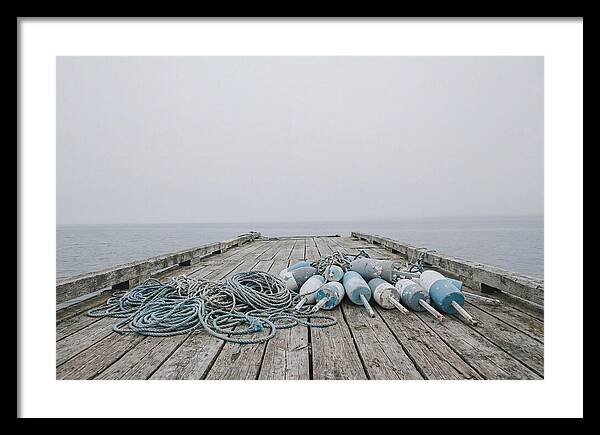 Rope And Lobster Buoys On Dock