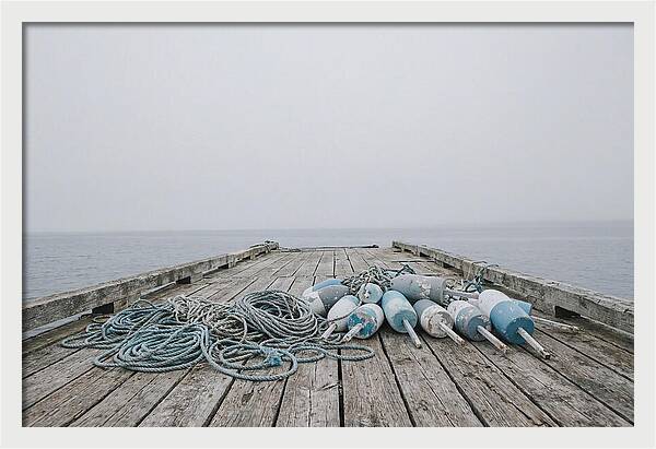 Rope And Lobster Buoys On Dock