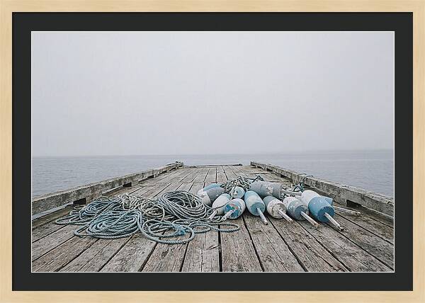 Rope And Lobster Buoys On Dock