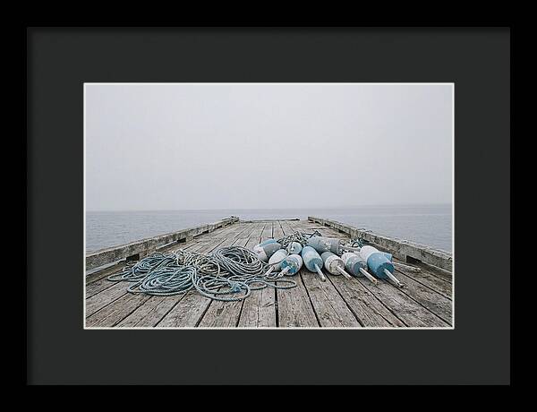 Rope And Lobster Buoys On Dock