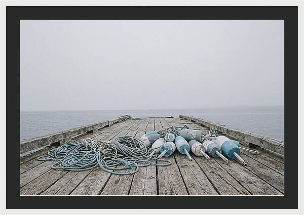 Rope And Lobster Buoys On Dock