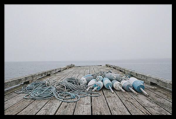 Rope And Lobster Buoys On Dock