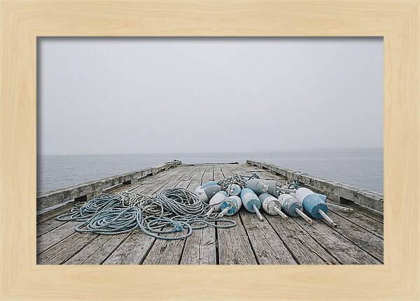 Rope And Lobster Buoys On Dock