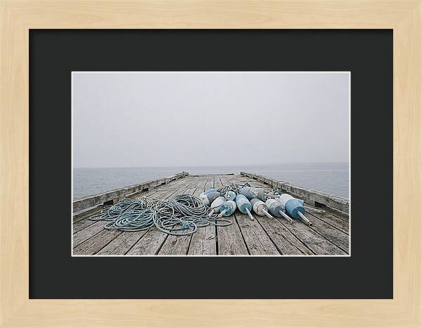 Rope And Lobster Buoys On Dock