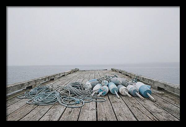 Rope And Lobster Buoys On Dock