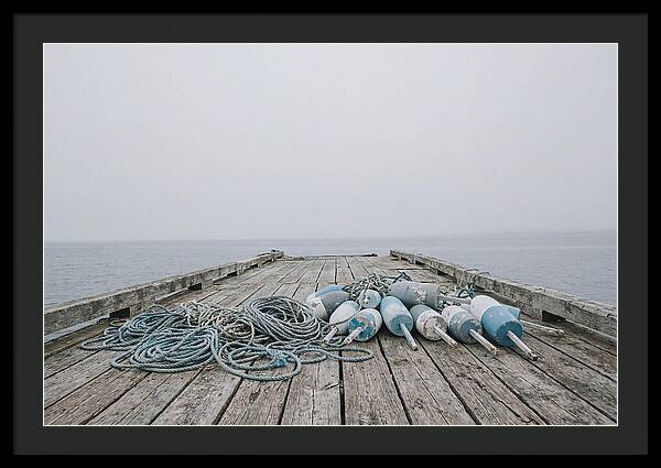 Rope And Lobster Buoys On Dock