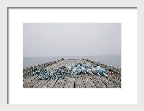 Rope And Lobster Buoys On Dock