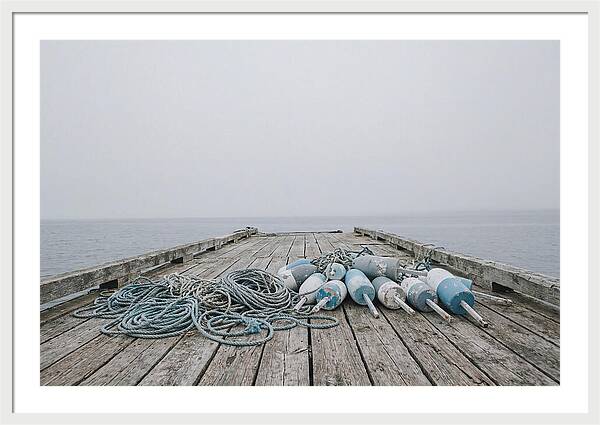 Rope And Lobster Buoys On Dock