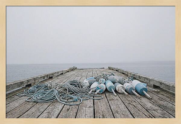Rope And Lobster Buoys On Dock
