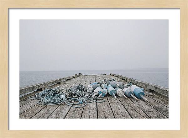 Rope And Lobster Buoys On Dock
