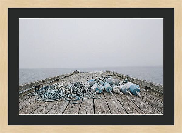 Rope And Lobster Buoys On Dock
