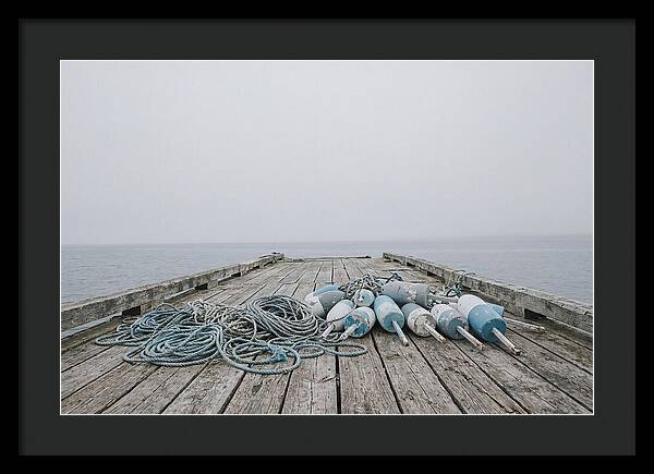 Rope And Lobster Buoys On Dock