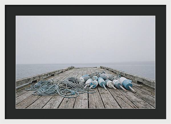 Rope And Lobster Buoys On Dock