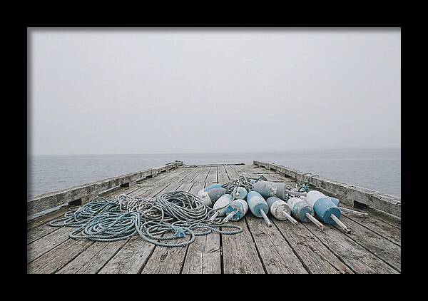 Rope And Lobster Buoys On Dock