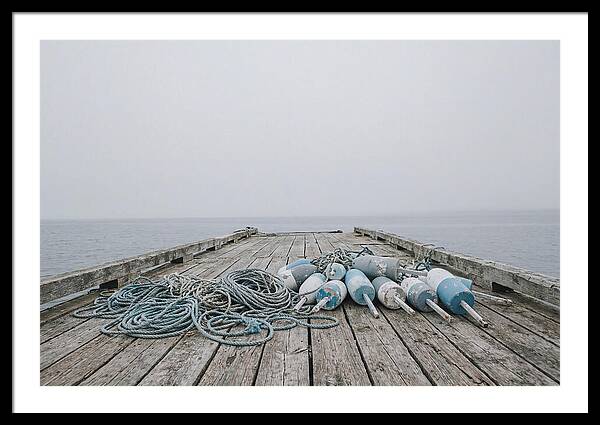Rope And Lobster Buoys On Dock