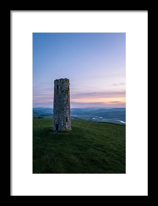 Round Stone Tower On Green Hillside
