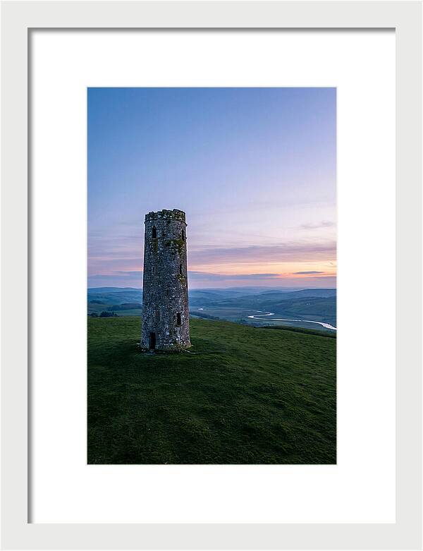 Round Stone Tower On Green Hillside