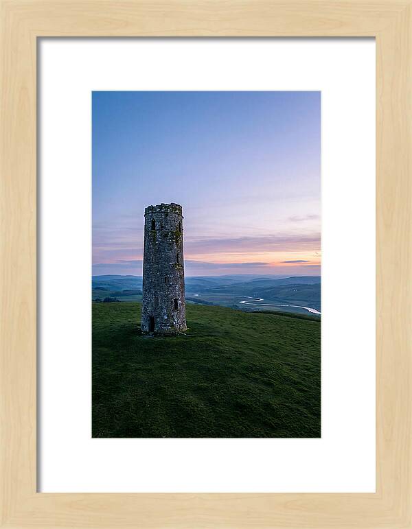 Round Stone Tower On Green Hillside