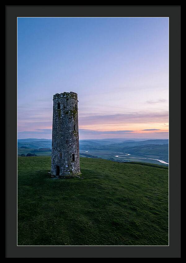 Round Stone Tower On Green Hillside