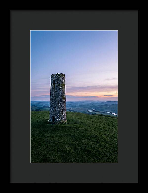 Round Stone Tower On Green Hillside