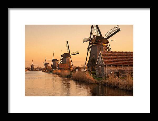 Row Of Windmills At Sunset