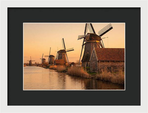 Row Of Windmills At Sunset