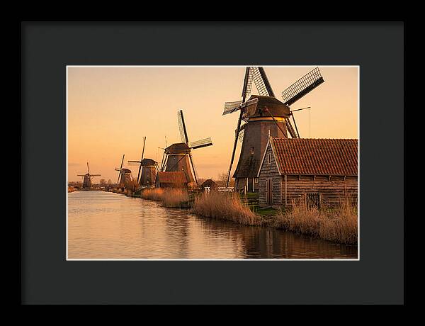 Row Of Windmills At Sunset