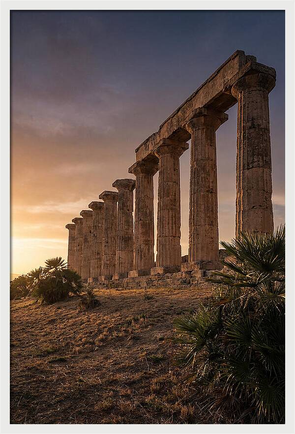 Ruins Of Ancient Columns At Sunset