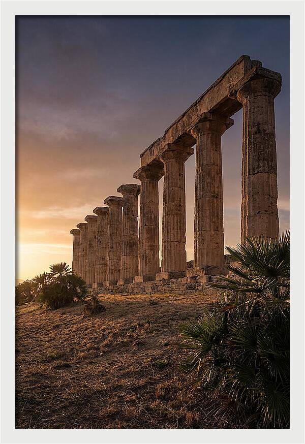 Ruins Of Ancient Columns At Sunset