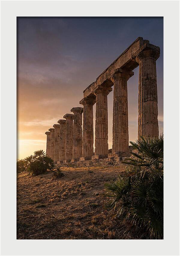 Ruins Of Ancient Columns At Sunset