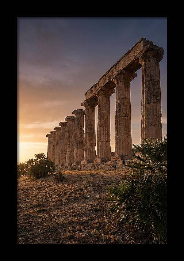 Ruins Of Ancient Columns At Sunset