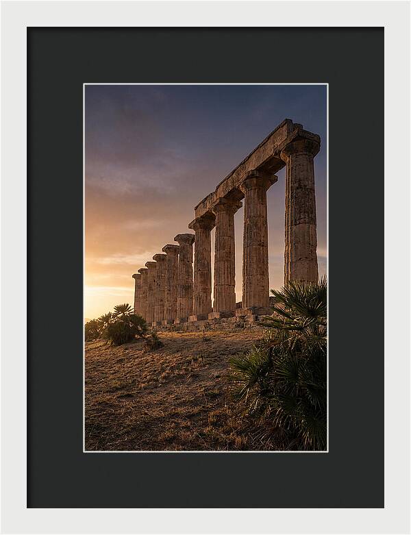 Ruins Of Ancient Columns At Sunset