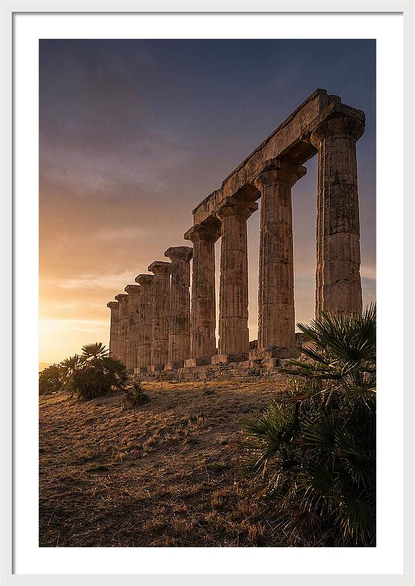 Ruins Of Ancient Columns At Sunset
