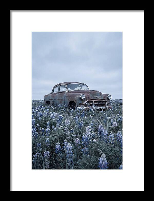 Rusted Classic Car Among Wildflowers
