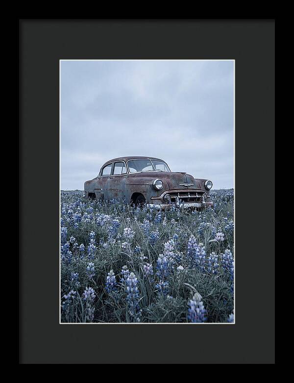 Rusted Classic Car Among Wildflowers