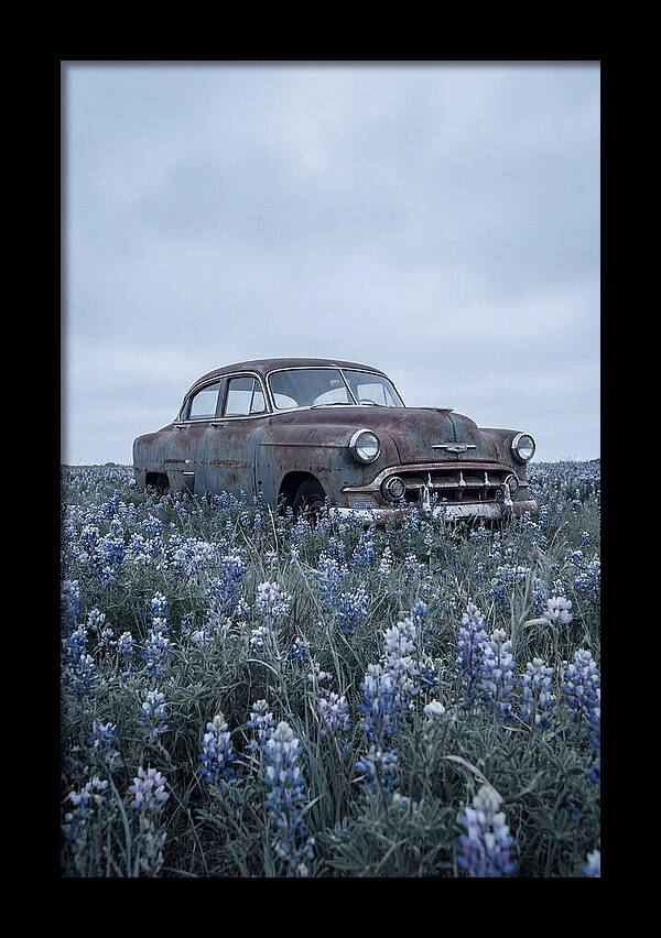 Rusted Classic Car Among Wildflowers