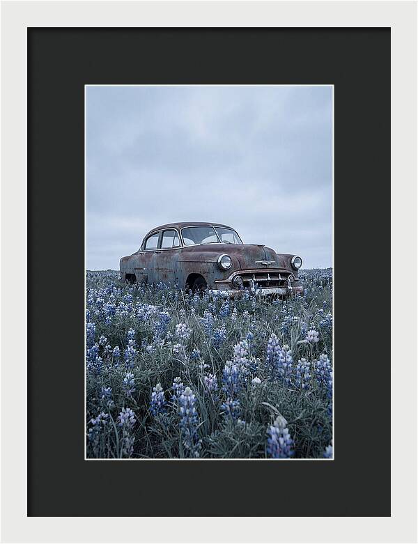 Rusted Classic Car Among Wildflowers