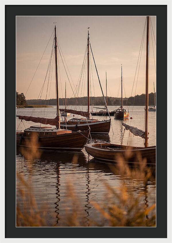 Sailboats Anchored In Tranquil Waters