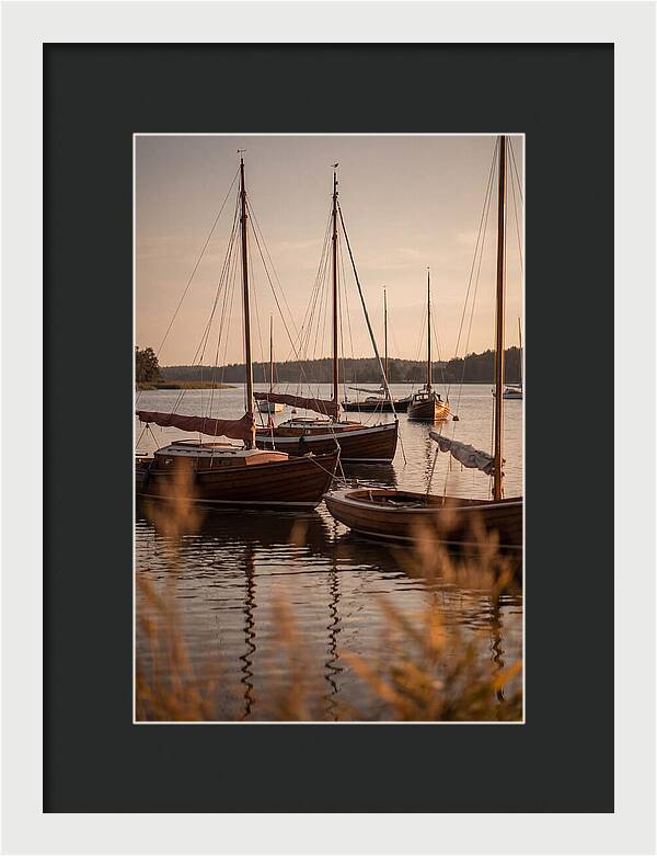 Sailboats Anchored In Tranquil Waters