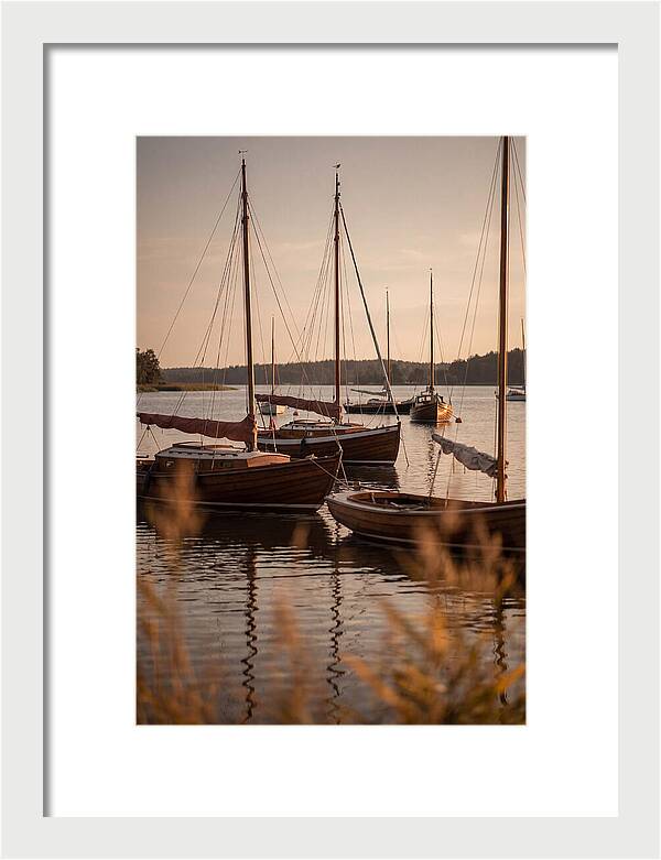 Sailboats Anchored In Tranquil Waters