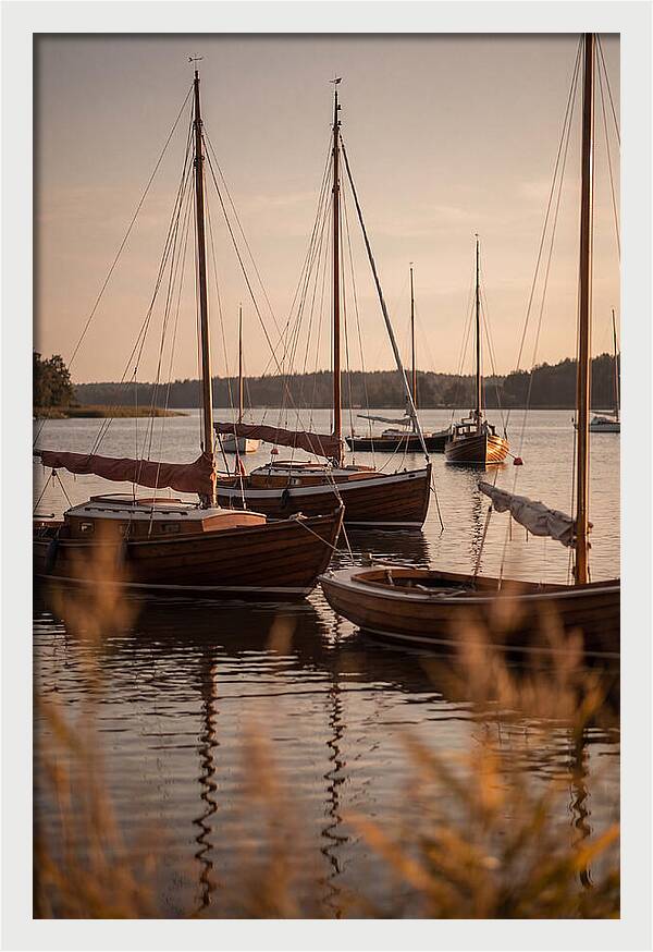 Sailboats Anchored In Tranquil Waters